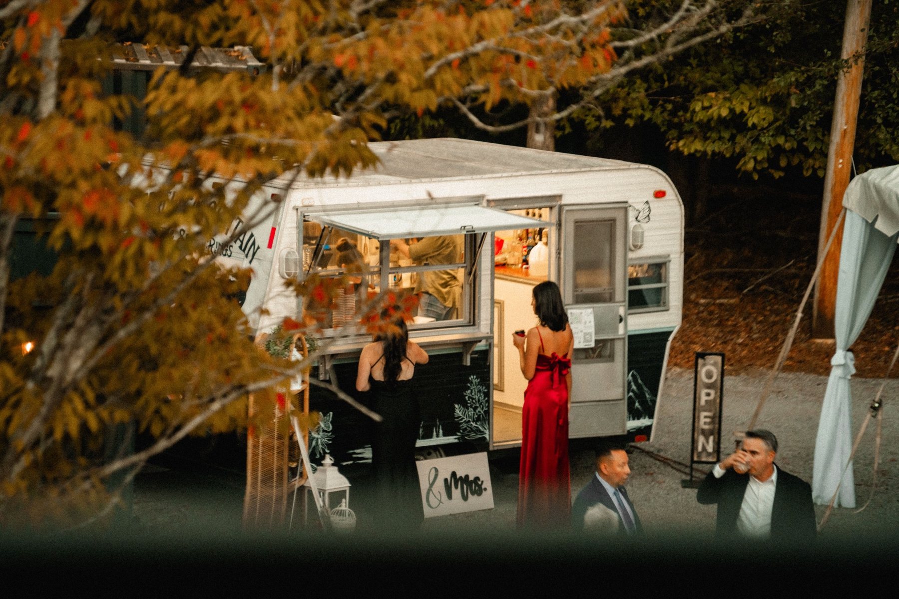 Butterfly Mountain Coffee Camper serving guests at a fall evening wedding